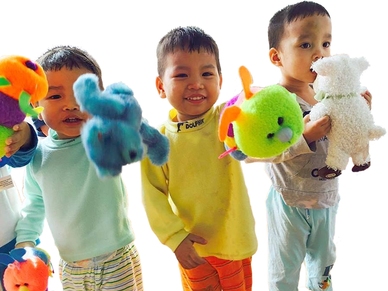 Children at an orphanage enjoy new toys